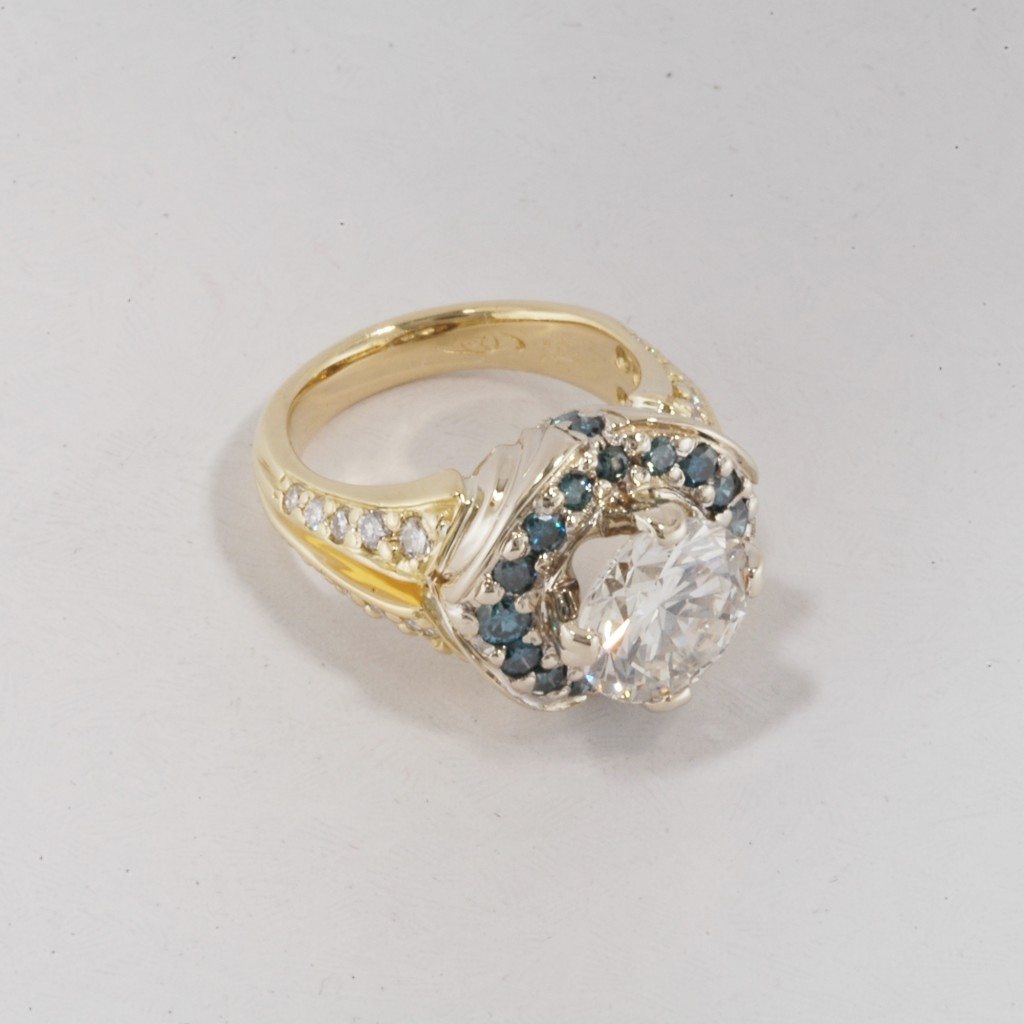 custom white and yellow gold diamond fancy ring with blue diamonds