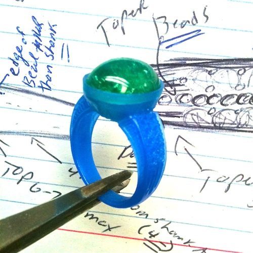 custom ring created in wax with notes and cabachon stone