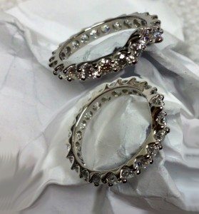 Platinum and diamond custom contoured eternity style diamond ring.