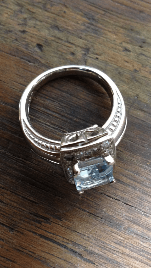 Custom designed 14Kt white gold diamond and aquamarine detailed ring