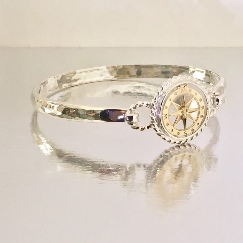 Custom Sterling Silver and 14 Kt Yellow Gold Compass Rose Bracelet Top Shown on our Exclusive Stellor Omega Bracelet