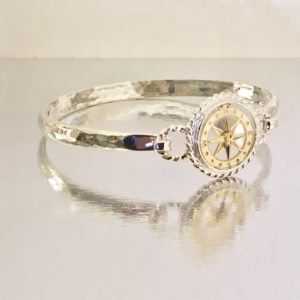 Custom Sterling Silver and 14 Kt Yellow Gold Compass Rose Bracelet Top Shown on our Exclusive Stellor Omega Bracelet